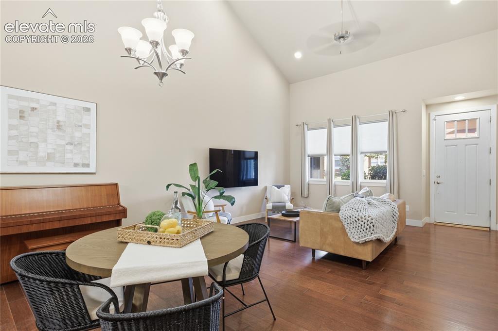 Image 7 of 28: Hardwood-finish flooring, vaulted ceiling with recessed lighting, ceiling f