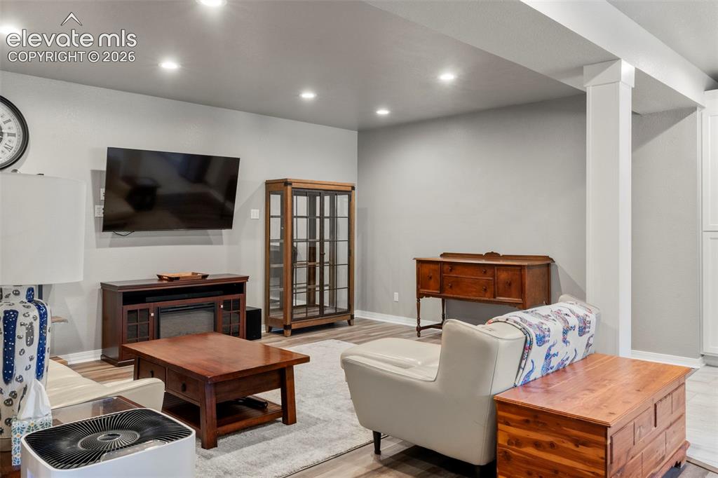 Image 29 of 46: Living area featuring recessed lighting and light wood finished floors