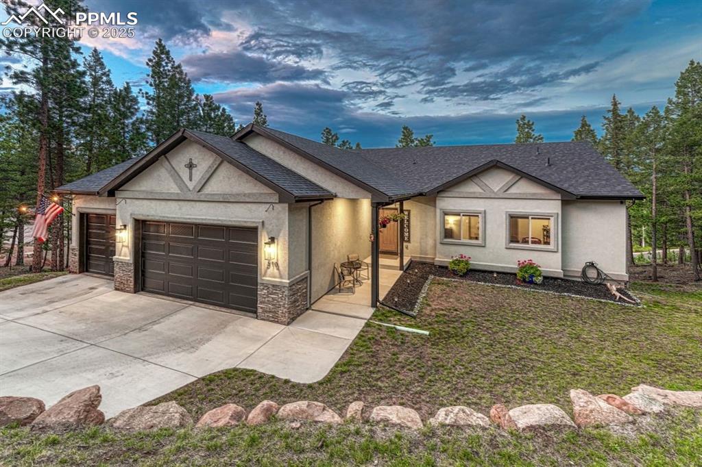 Caption: This charming home was built in 2022 and is perfectly positioned on a private lane in Woodland Park 