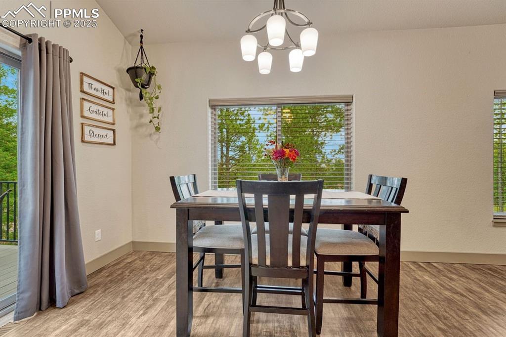 Image 12 of 32: Perched above the neighboring homes, this property offers beautiful natural