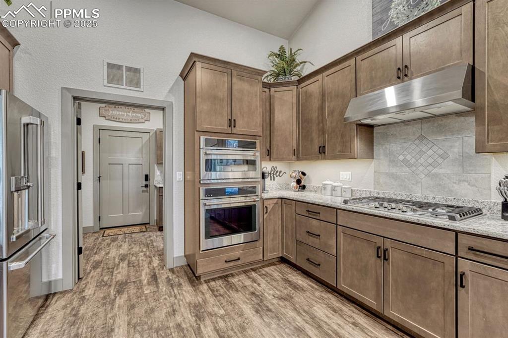 Image 14 of 32: GE Cafe appliances include 36" gas range with power boil & griddle, Wi-Fi e
