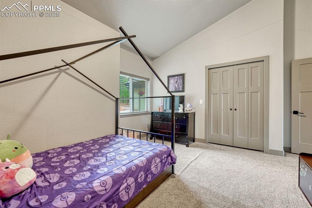 Image 23 of 32: Double closet has interior lighting for easy access to every corner
