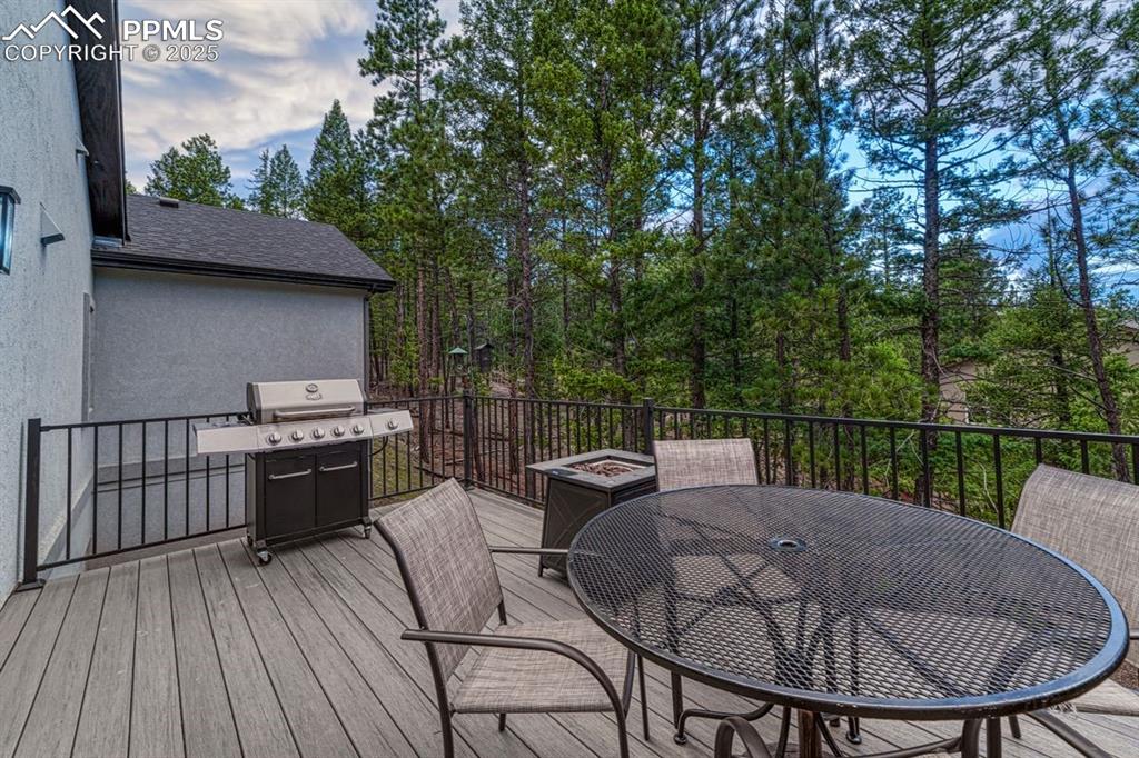 Image 25 of 32: Enjoy outdoor living on the deck, just steps from the dining nook and kitch
