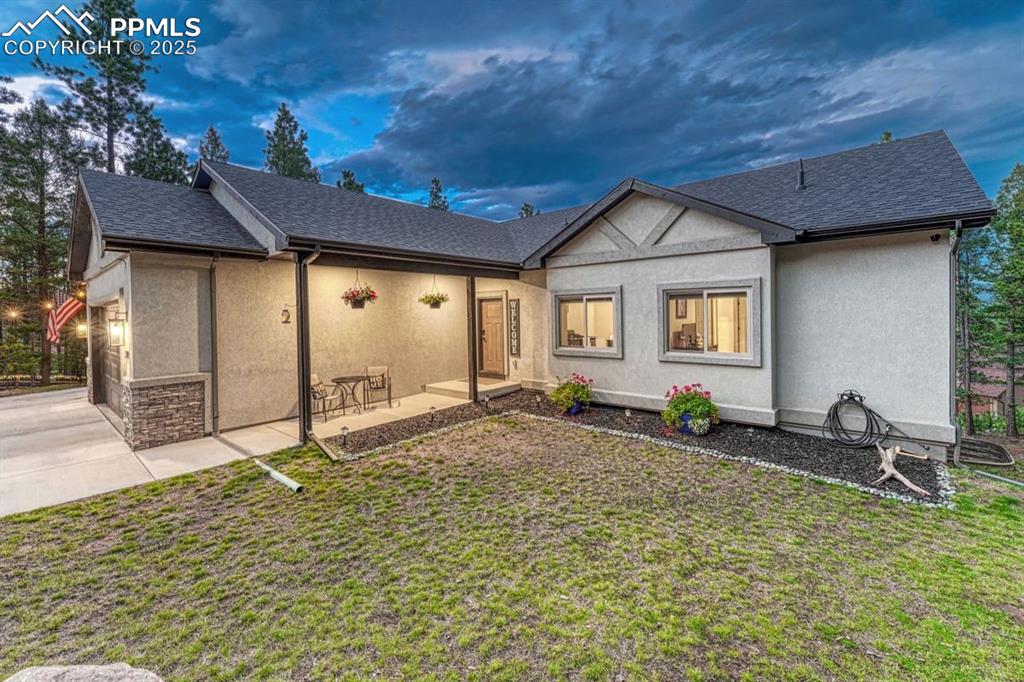 Image 7 of 32: A covered entry is a Colorado essential—perfect for taking in a quiet summe