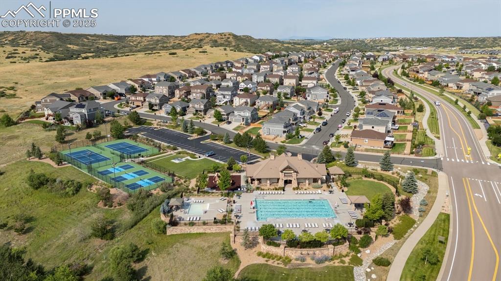 Image 36 of 36: Aerial view of property and surrounding area with nearby suburban area and