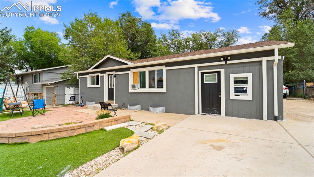 Image 2 of 21: front of property featuring a patio area