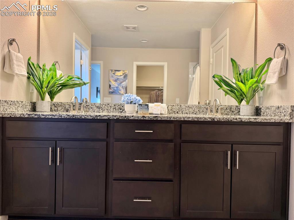 Image 19 of 41: Full bathroom with double vanity