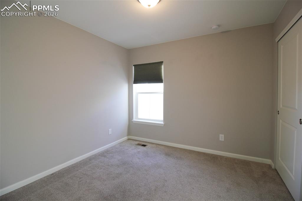 Image 26 of 41: Unfurnished bedroom with a closet and carpet