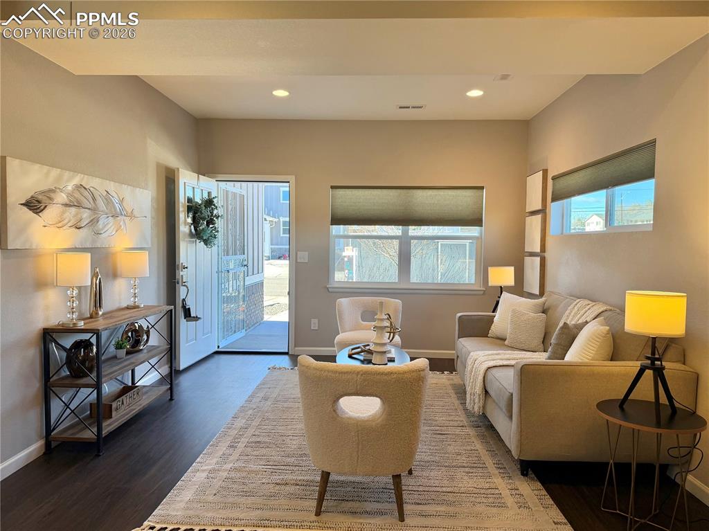 Image 4 of 41: Living area featuring healthy amount of natural light, recessed lighting, a