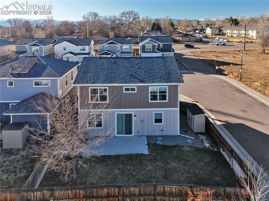Image 45 of 48: Back of property with a residential view, a patio, and a fenced backyard