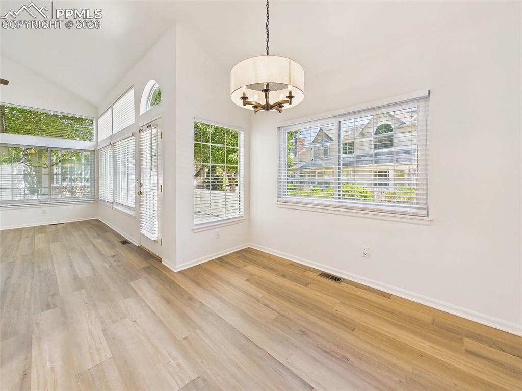 Image 11 of 50: Dining & Living Connection – Seamless transition from dining to living room