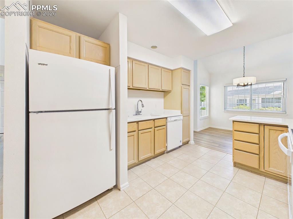 Image 18 of 50: Kitchen (Alternate Angle) – Well-designed kitchen offering generous counter