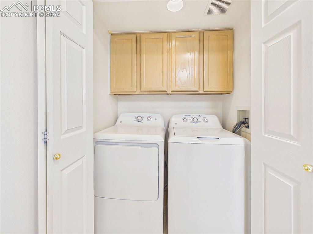 Image 21 of 50: Laundry Closet – Dedicated laundry area with included washer and dryer and 