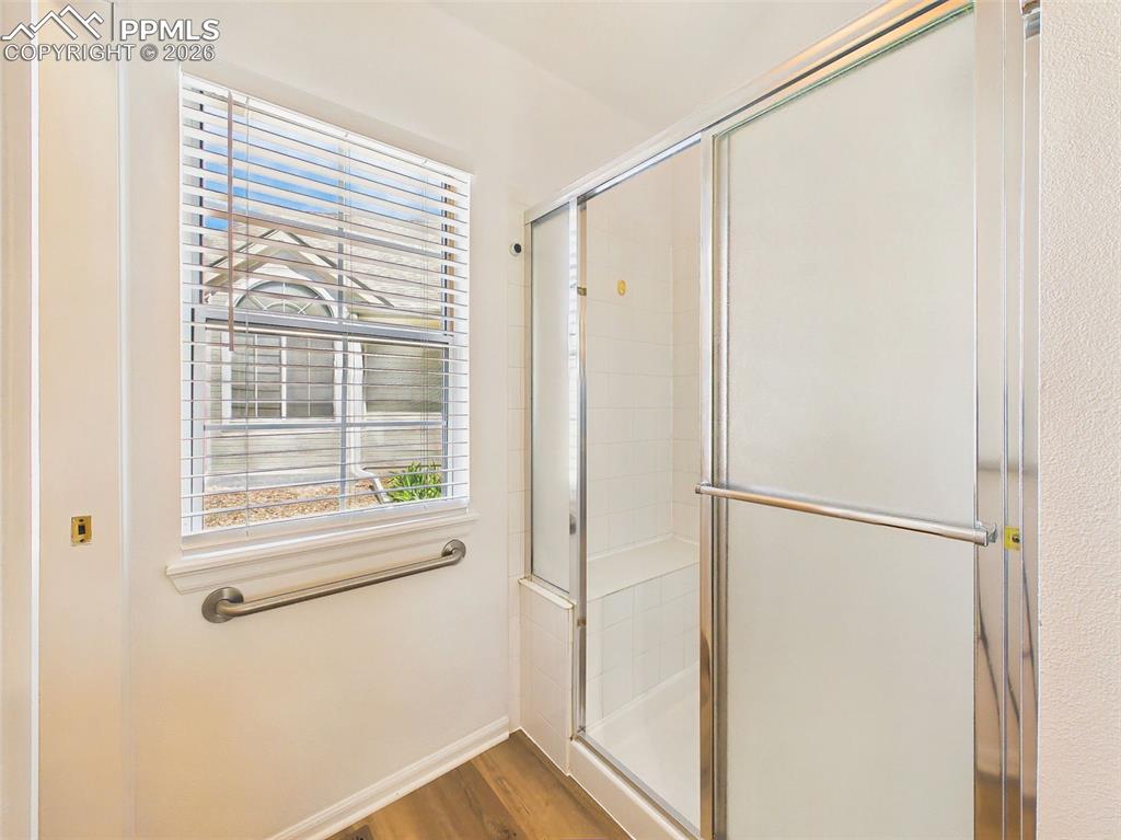 Image 28 of 50: Full Bathroom (Shower) – Bright bathroom with step-in shower, sliding glass