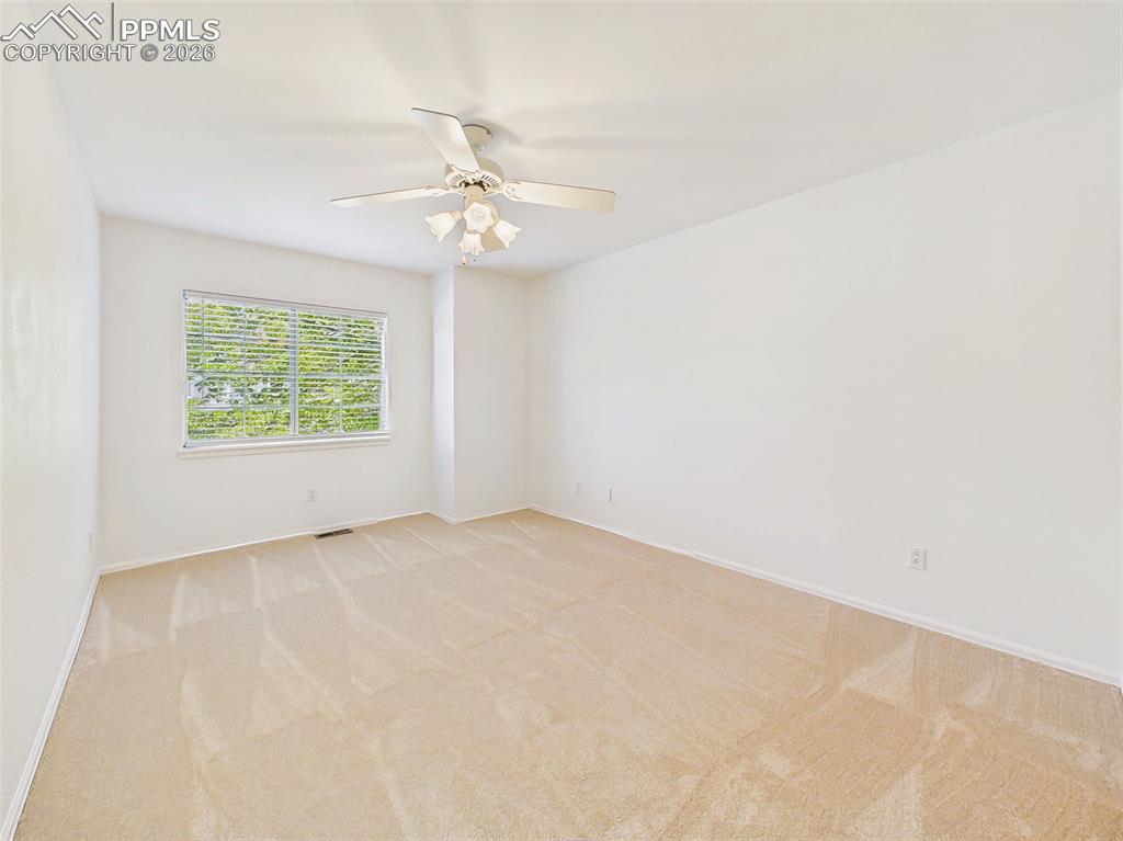 Image 34 of 50: Bedroom (Unfurnished Alternate) – Open and airy bedroom with neutral tones 