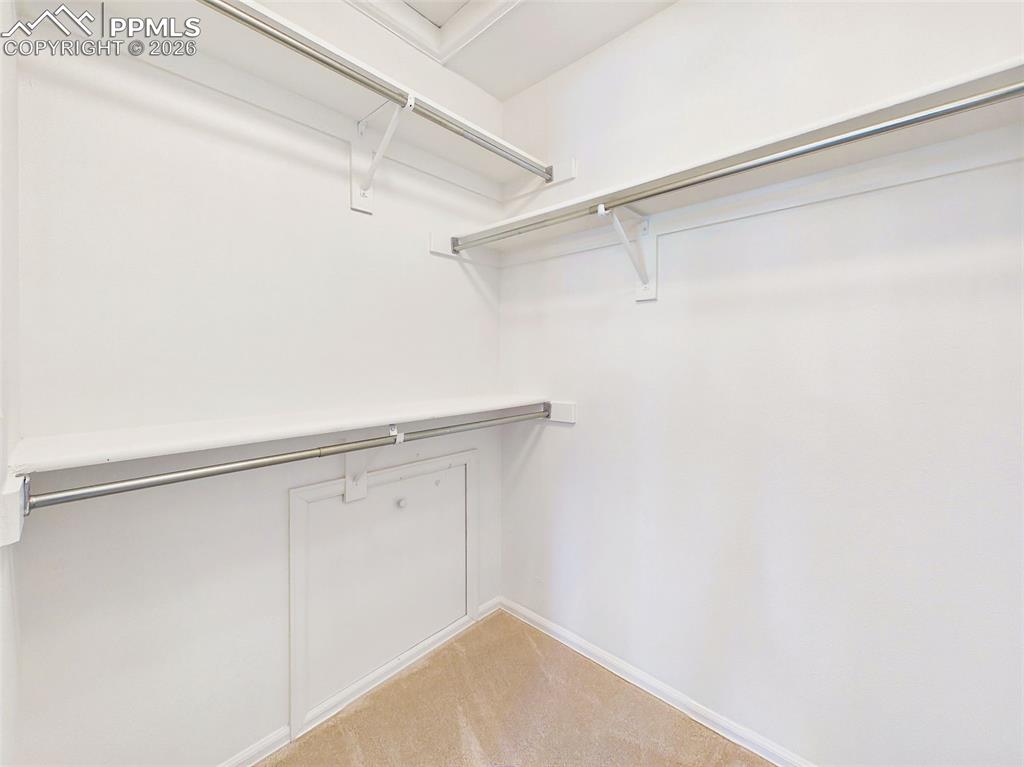 Image 36 of 50: Walk-In Closet – Generous walk-in closet with multiple hanging levels and b