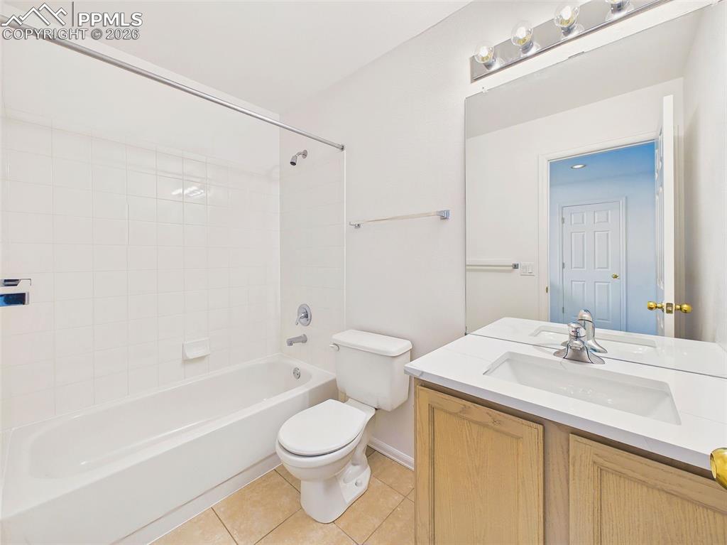 Image 39 of 50: Full Bathroom – Clean and functional full bath featuring a tub/shower combi