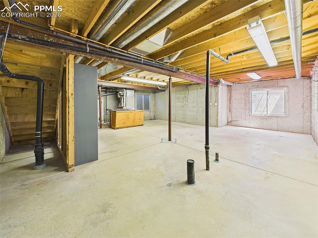 Image 40 of 50: Unfinished Basement – Expansive unfinished basement offering abundant stora