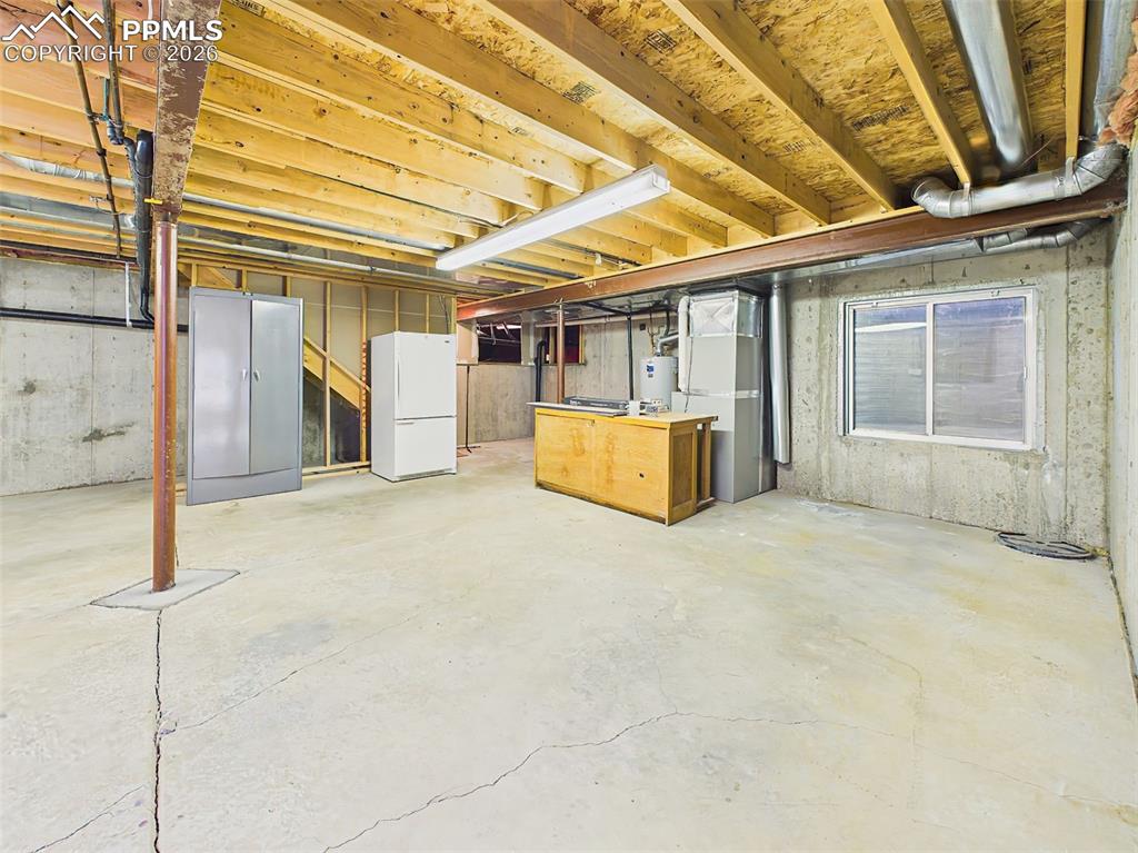 Image 41 of 50: Basement (Alternate View) – Additional view of the unfinished basement show