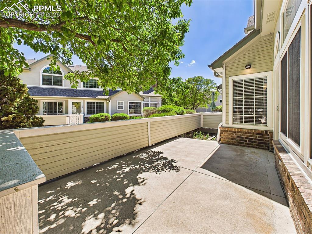 Image 43 of 50: Private Patio – Fenced patio space perfect for outdoor seating, dining, or 