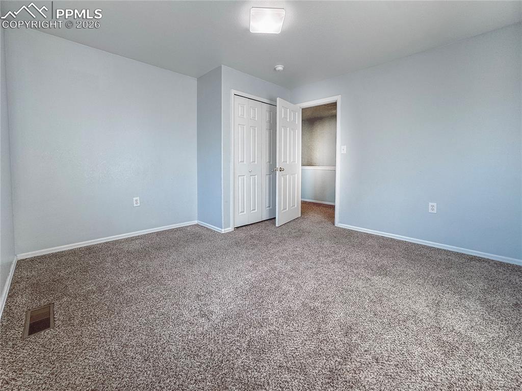 Image 10 of 27: Unfurnished bedroom featuring carpet floors and a closet