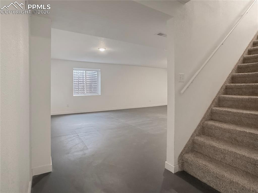 Image 17 of 27: Below grade area featuring baseboards