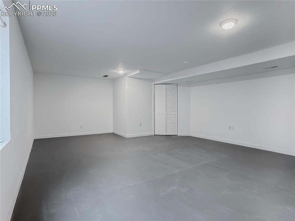 Image 19 of 27: Finished basement with baseboards