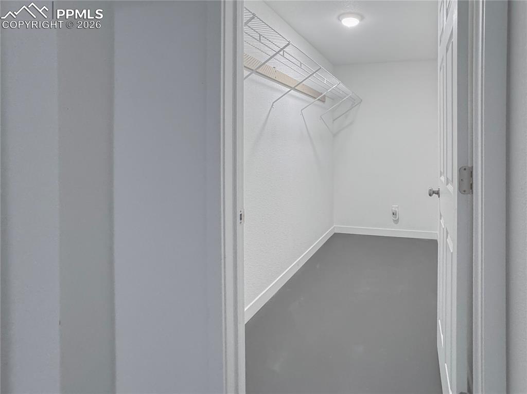 Image 22 of 27: View of walk in closet