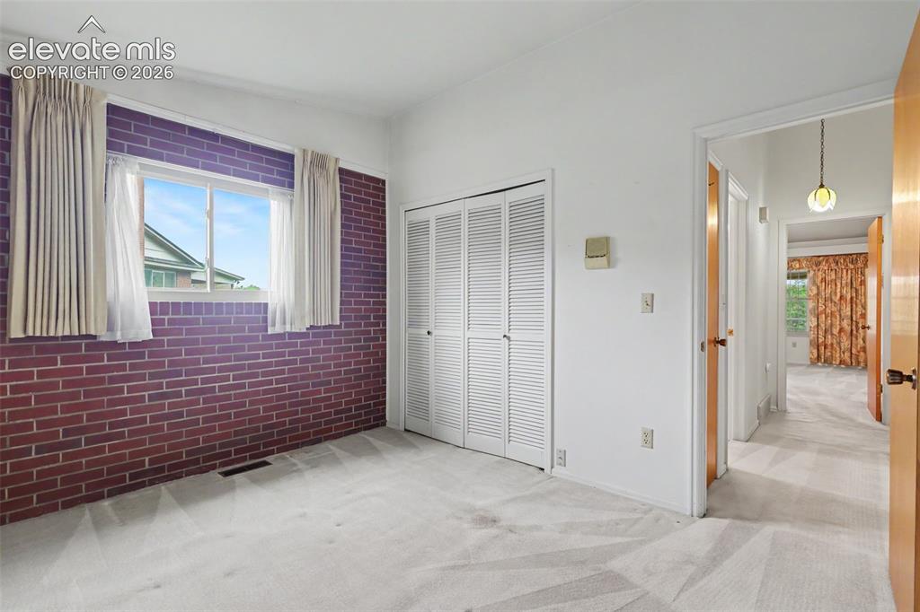 Image 21 of 37: Main level secondary bedroom