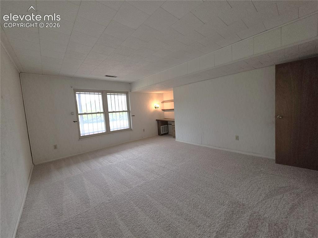 Image 26 of 37: Basement bedroom