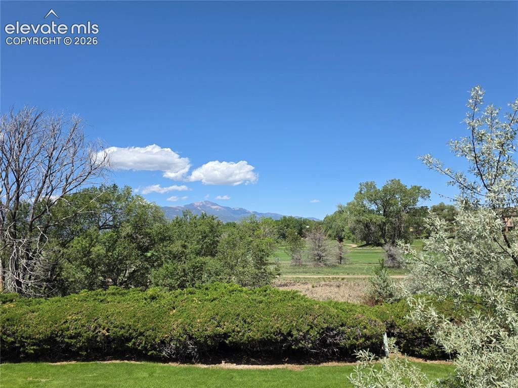 Image 33 of 37: Pikes Peak and golf course