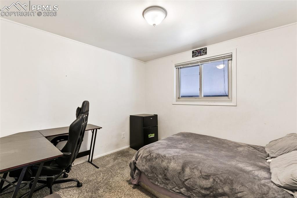 Image 16 of 49: Upper level full bath with dual vanity