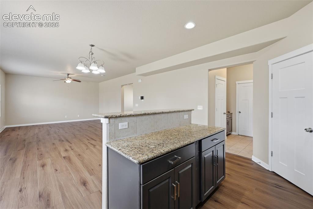 Image 16 of 34: A large fenced backyard offers room for pets, play, gardening and outdoor e