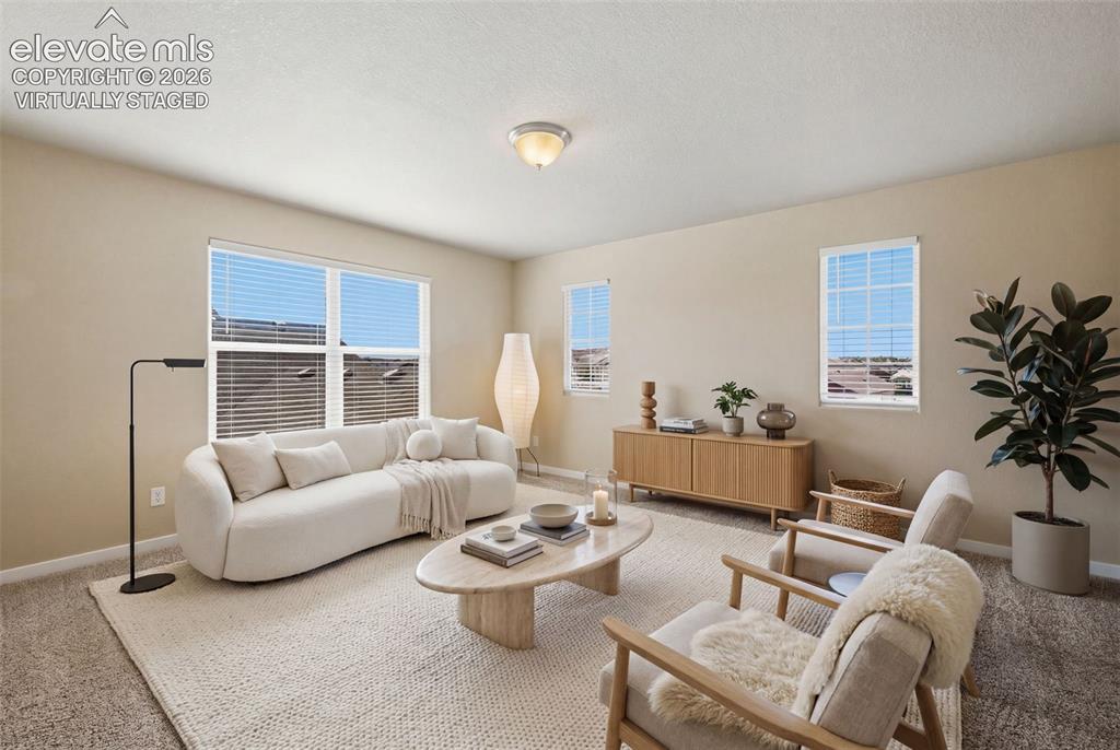 Image 18 of 34: Virtually staged to show comfortable seating for a full-size dining table w