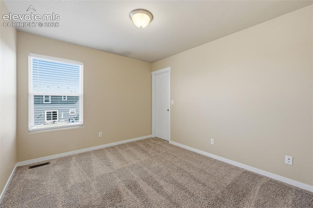 Image 22 of 34: A true bonus on the main level—adapt this separate room to fit the way you