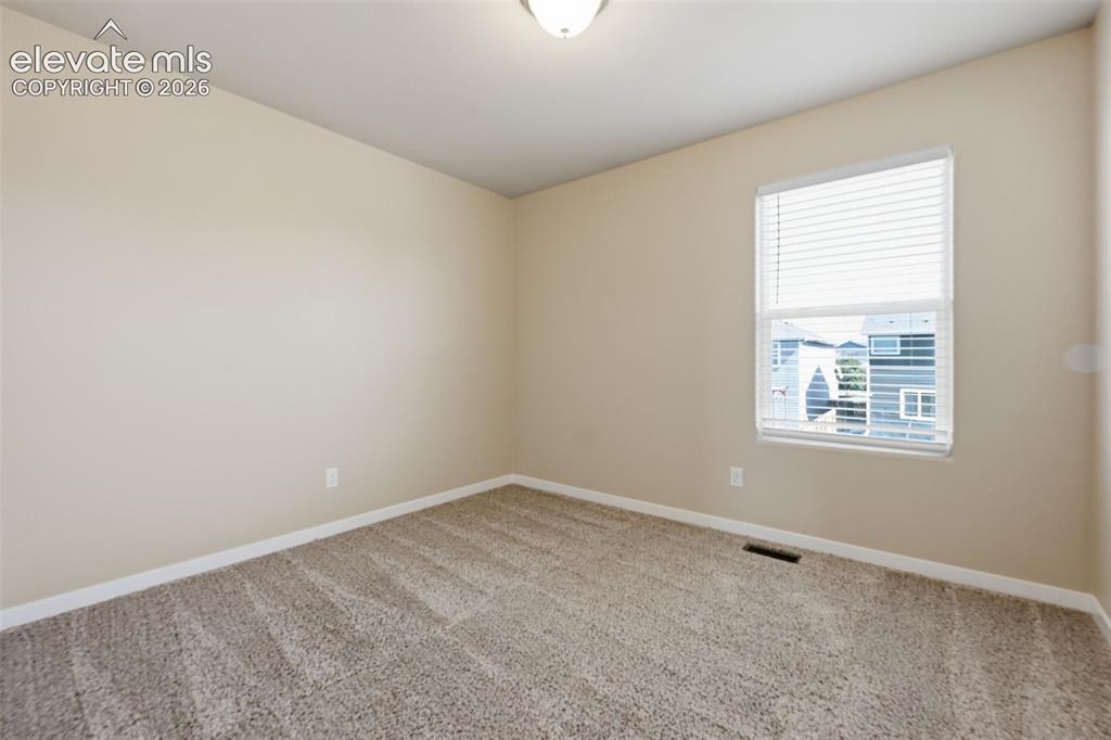 Image 23 of 34: The bright entry opens to the staircase and offers a clear sightline into t