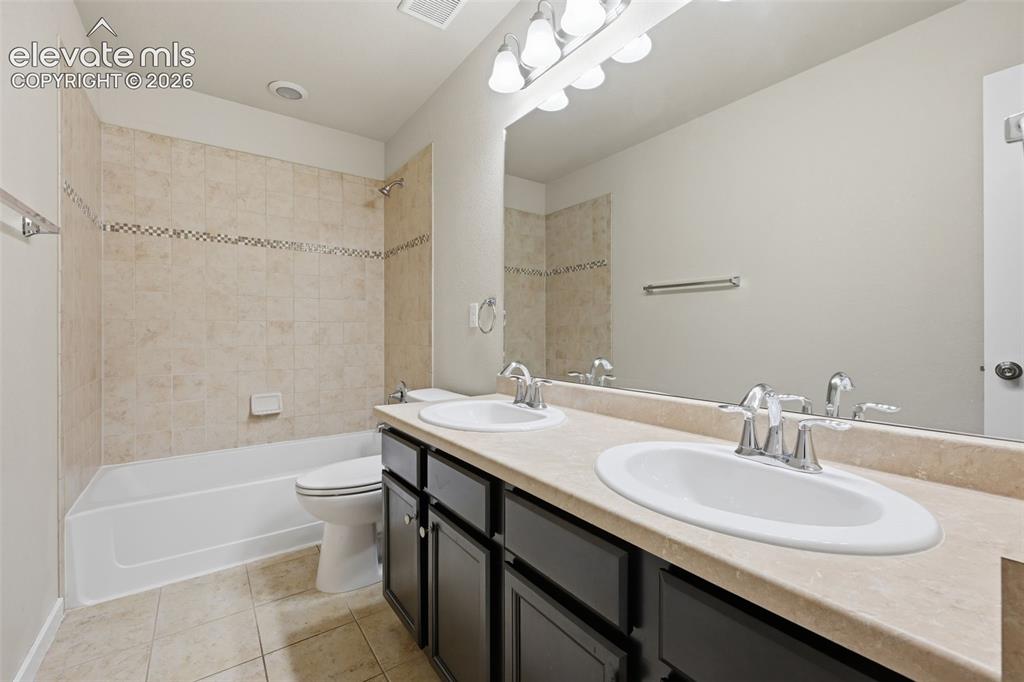 Image 24 of 34: A convenient main-level powder bath serves guests without sending them upst