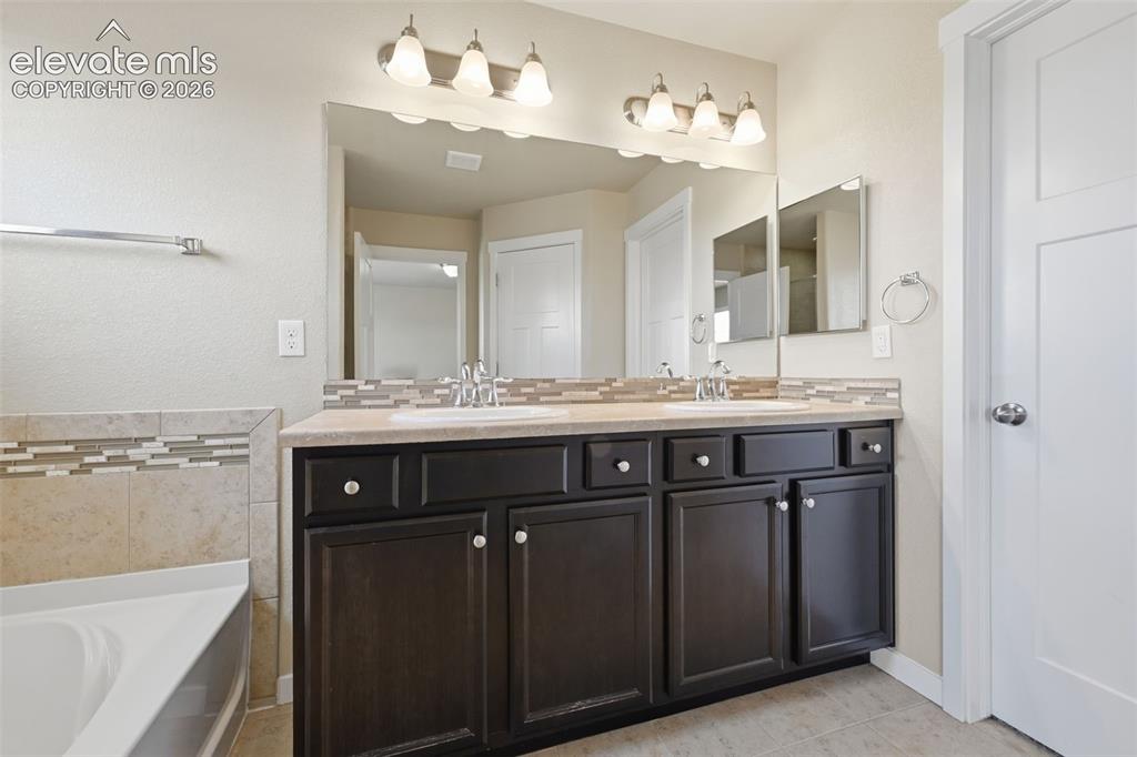 Image 29 of 34: Laundry is conveniently located on the same level as four of the home