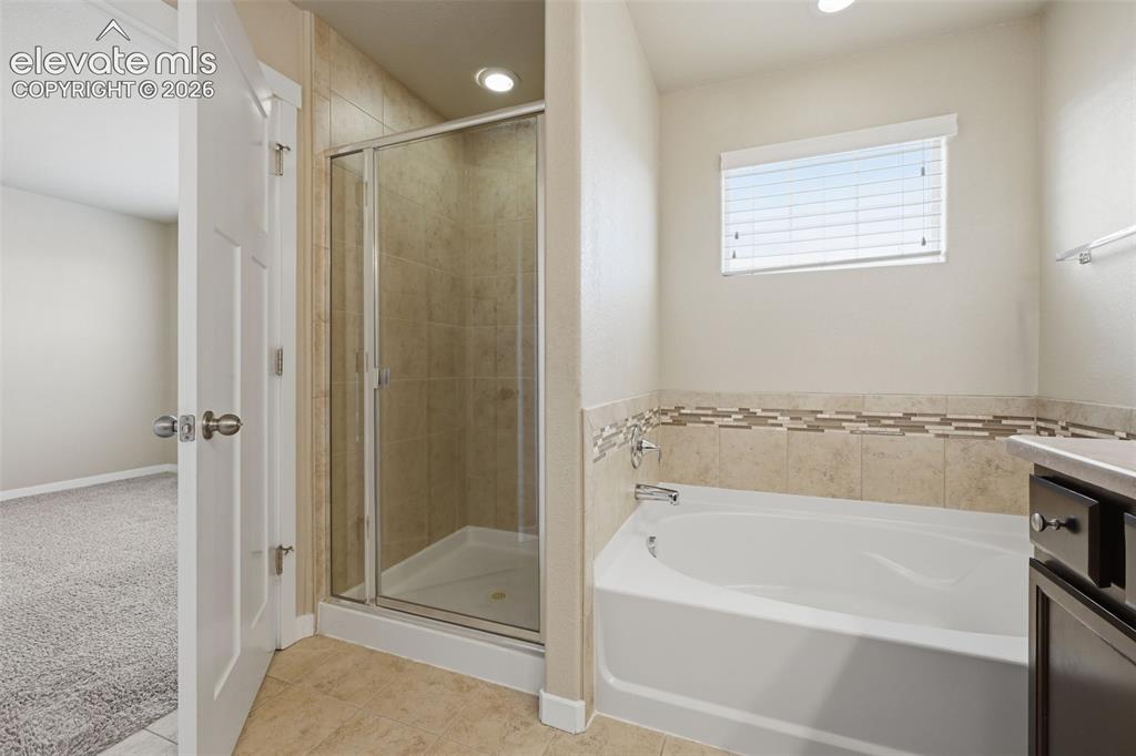 Image 30 of 34: The fifth bedroom is located in the finished basement, creating separation