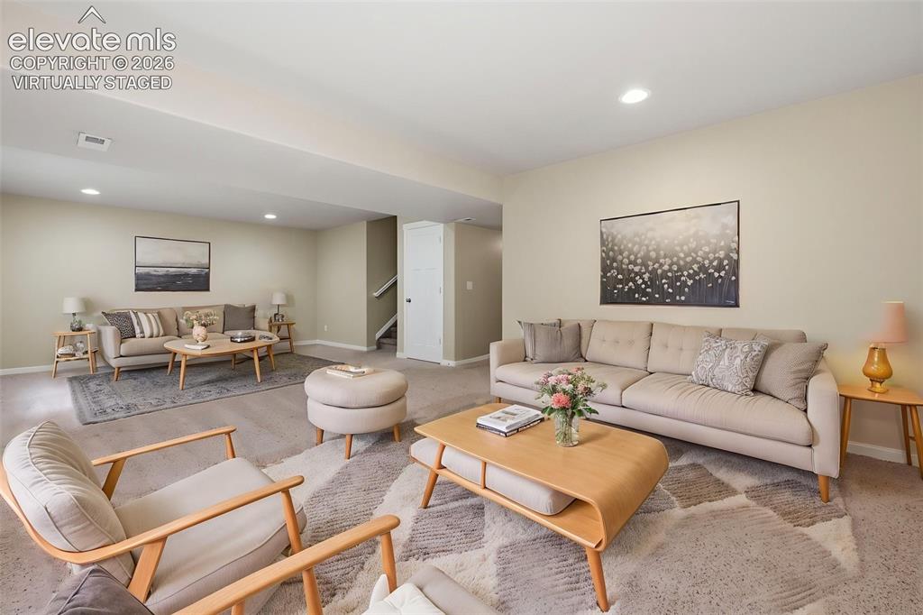 Image 32 of 34: Main level: flex room, open living/dining/kitchen areas and convenient powd
