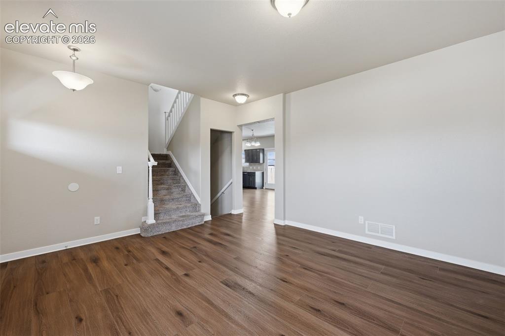 Image 6 of 34: An open layout keeps the living, dining and kitchen spaces connected while