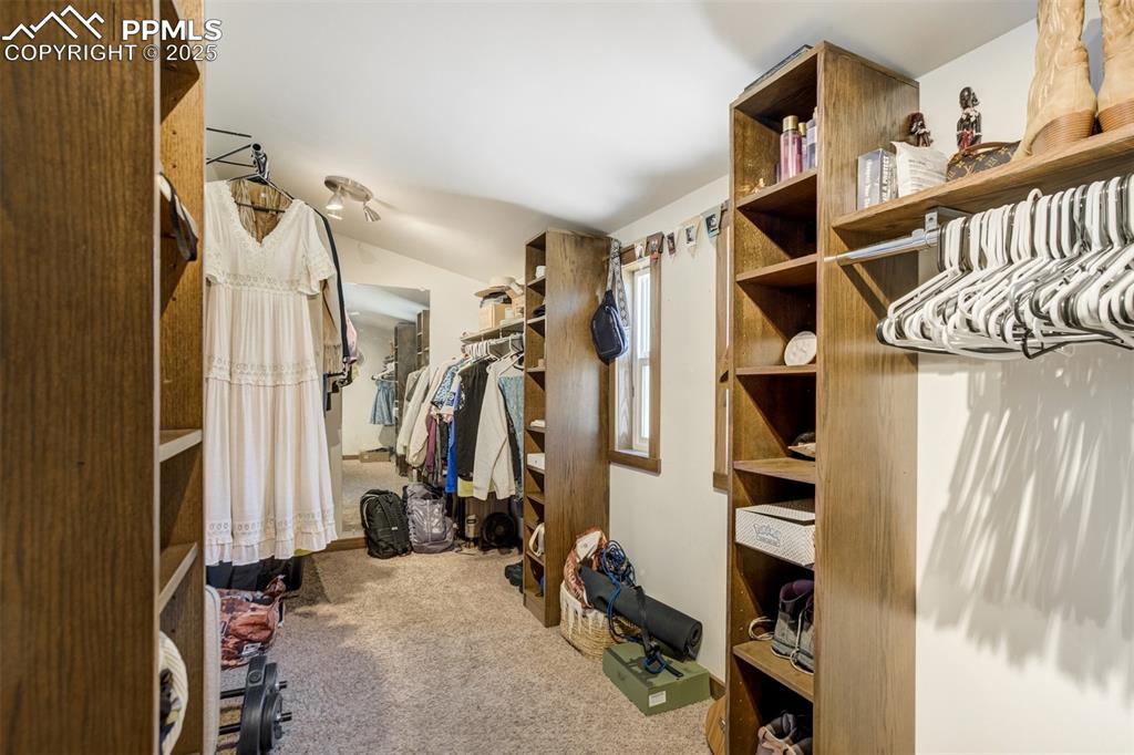Image 18 of 50: Walk-in closet of Primary Bedroom 6