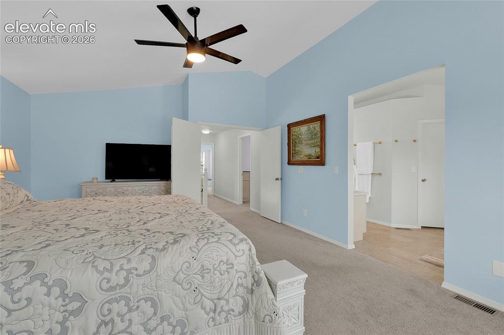 Image 13 of 35: Primary Bedroom with Ensuite Bathroom