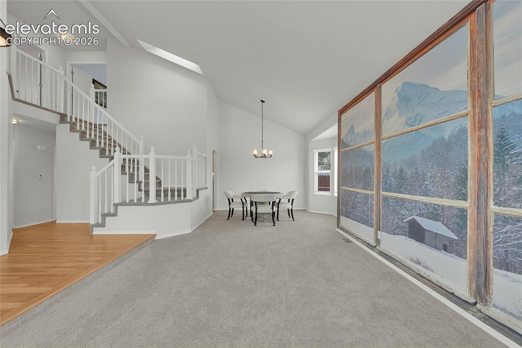 Image 7 of 35: Living Room and Formal Dining Area
