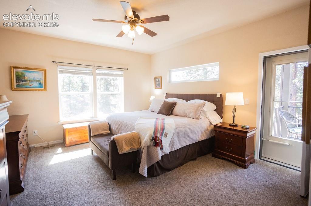 Image 14 of 40: Primary bedroom with private deck