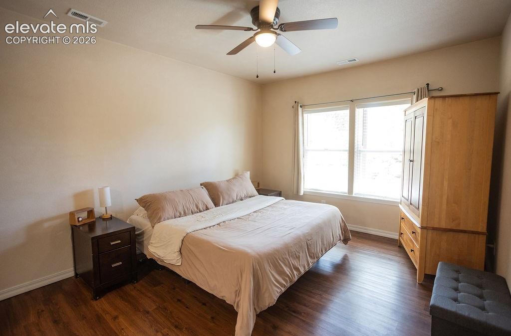 Image 23 of 40: Lower bedroom with attached bathroom
