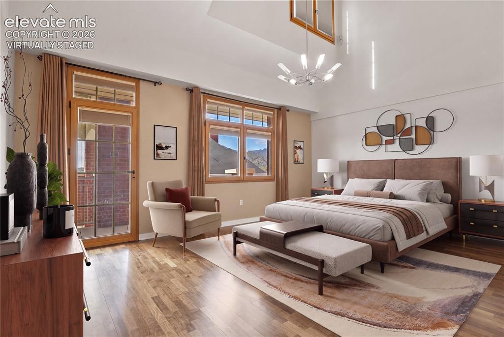 Image 11 of 50: Spacious main level primary bedroom. Virtually Staged