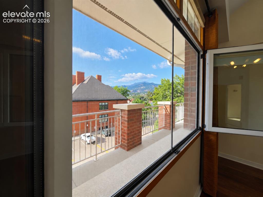 Image 12 of 50: Cheyenne Mountain views from the primary bedroom
