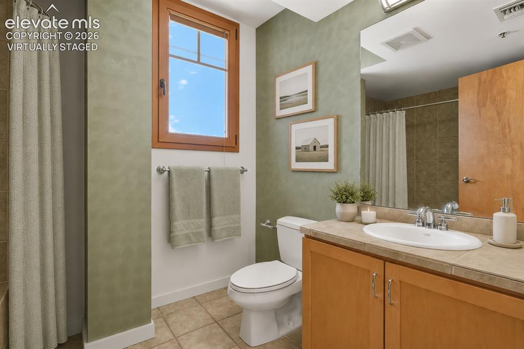 Image 17 of 50: Main level guest bath. Virtually Staged
