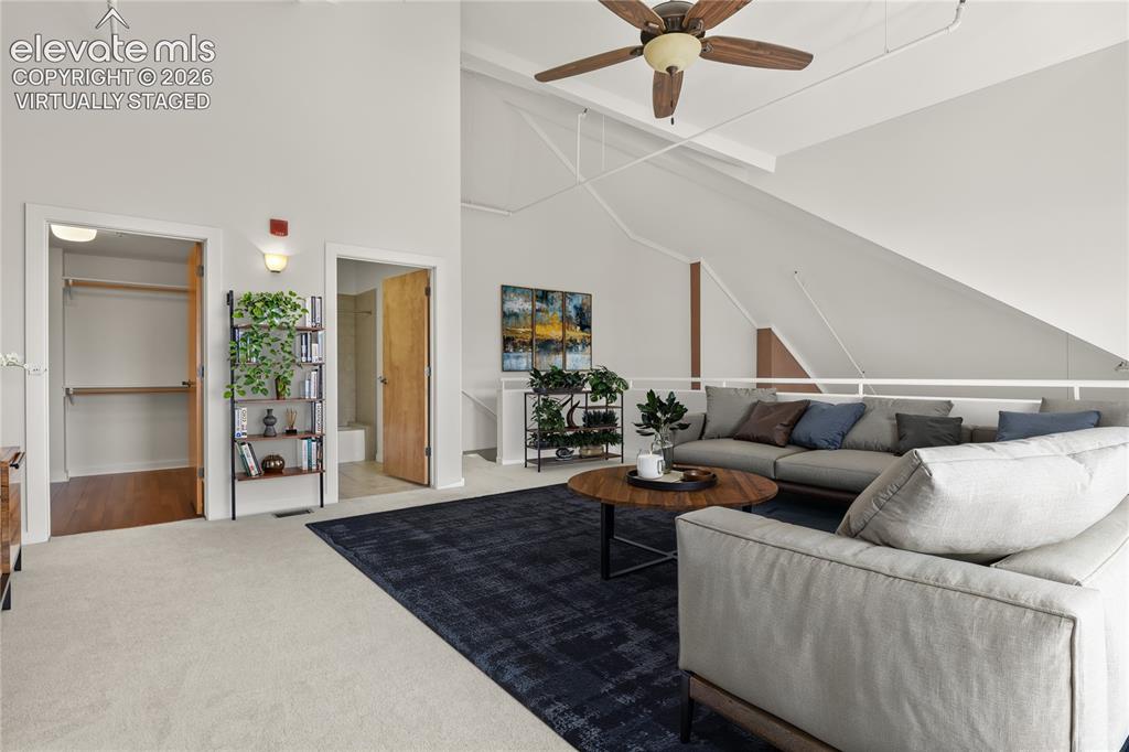 Image 21 of 50: Upper level lofted area with abundant storage and full bath. Virtually Stag